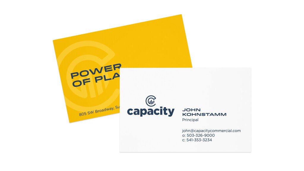 A business card mock-up for Capacity Commercial.