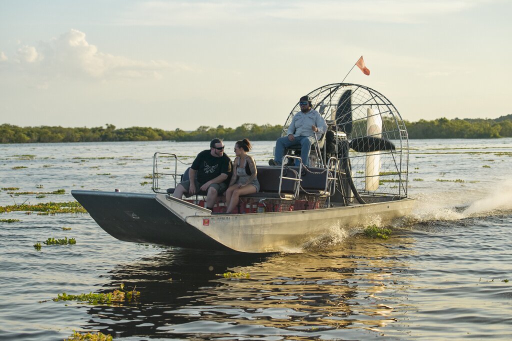 Alan Folts and Kaila Cumings on a fan boat in a Florida bayou.