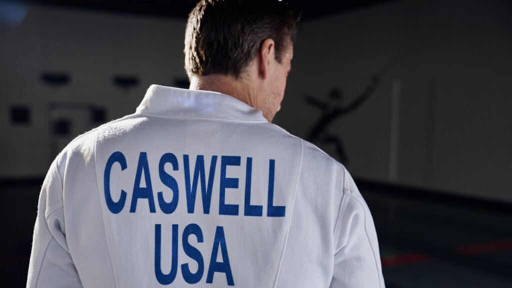 A photo of Joe Caswell in a fencing gym.