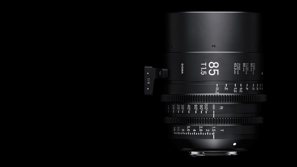 An image of a Sigma 85mm cine lens over a black background.