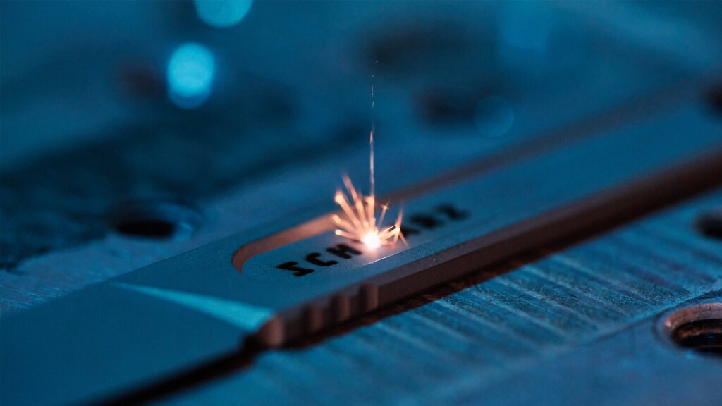 A laser etching machine etching a design on a knife.